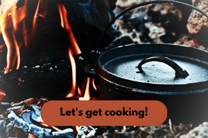 A cast iron dutch oven sits on a fire. Next to it a log is aflame. Below, black text on an orange field reads, Let's get cooking! Photo by Melody Ayres-Griffiths on Unsplash.